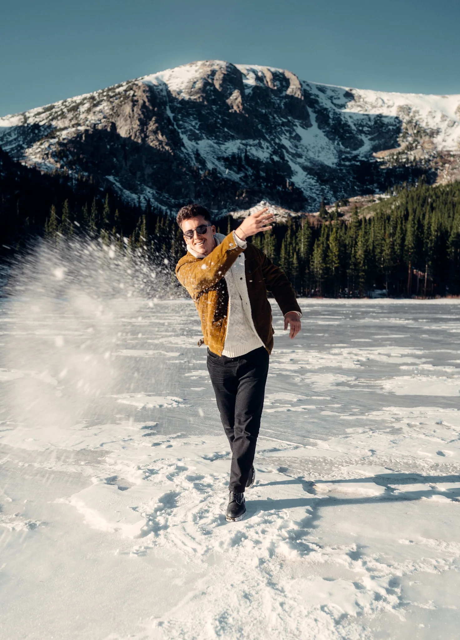 Lifestyle portrait on a frozen mountain lake